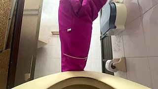 Camera captures nurse peeing in public toilet lycra