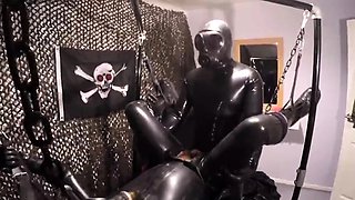 Kinky gay lovers in latex indulge in hardcore sex action