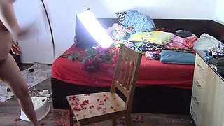 Sexy has fun with roses naked. The sexy epilates the hair on her legs.