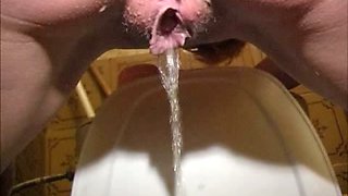 Juggy redhead hussy strips in the toilet and shows how she pees