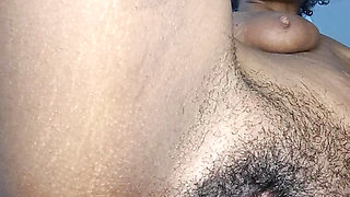 Playful brunette shows you a close up of her hairy pussy