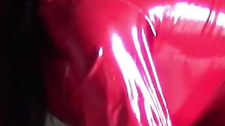 MILF in Red Latex Suit and Patent Leather High Heels Gives a Blowjob with Swallow
