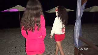 Brunette Friends Piss Together on Beach