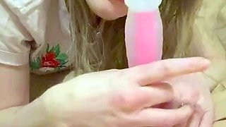 Blonde teen slut plays with a toy banana