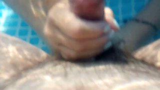 Underwater foot job in backyard pool