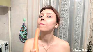 Trixie masturbates in her kitchen with a carrot - WeAreHairy