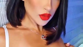 Close up video of a solo brunette with natural tits having fun