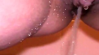 MILF with Pierced Pussy and Big Lips Pissing in Close-up in Her Shower