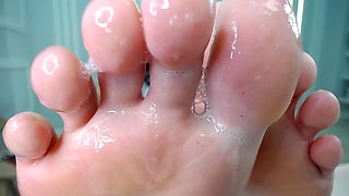 Saliva spit on her feet