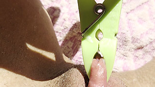 Inserting a small cup into the wet pussy