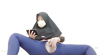 Indonesian hijab aunt wearing cucumber