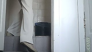 Lovely white lady in strict office dress pisses in the toilet room