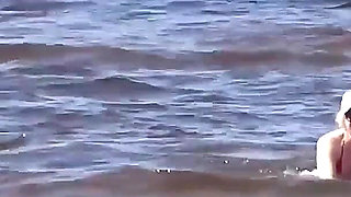 Funny Mommy Has Fun on the Beach with Young Guys