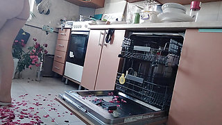 Sexy nude wife preparing food in the kitchen. Hairy brown hair, big ass, big tits.