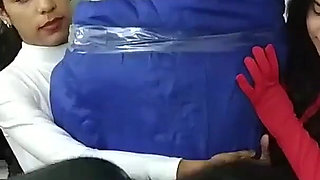 Latino Hunk Heavily Mummified by Cooperative Femdom Women