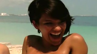 Cute brunette babe gets fucked on a beach