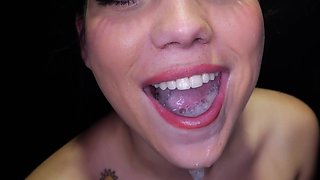 Brunette Lilith Grace gets spunk sprayed in her mouth through a gloryhole
