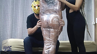 Luana Mummified with Plastic Wrap