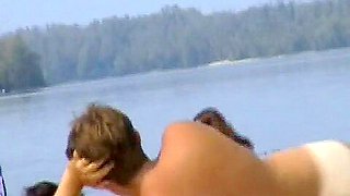 A horny nude beach couple having some fun together