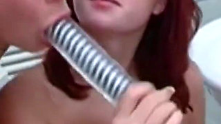 Redhead gets massive dildo in her ass by her friend