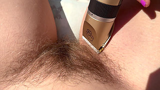 Trimming my bush and my hairy legs closeup outdoor