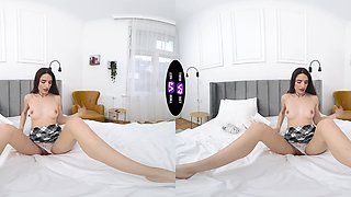 A hot brunette college girl plays with her pussy in vr