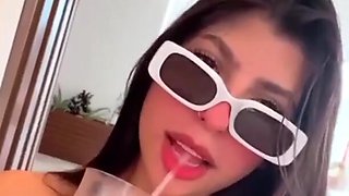 Solo brunette chick drinking and having fun in a homemade video