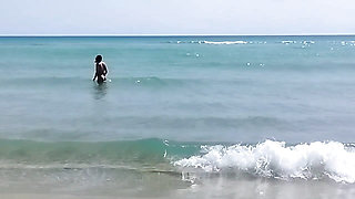 On a nudist beach I meet a guy masturbating and I help him