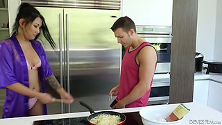 Adorable Asian housewife Jade Luv gives a blowjob in the kitchen and gets her slit fucked on the couch