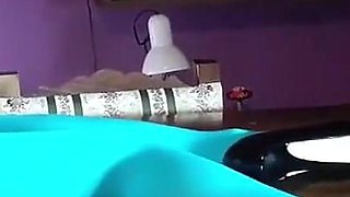 MILF with Beautiful Legs in Pantyhose and Heels Lying on the Table