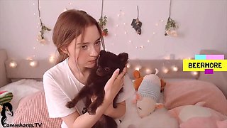Petite plays on bed