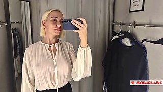 Trying on transparent clothes with huge tits in the dressing room