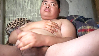 Pulling the penis on the bed