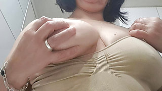 Mature milf enjoys rubbing her nipples and gets wet