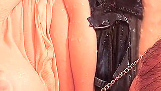 Tied in the Bathtub, the MILF Gets a Shower Stream at Her Clit While the Pussy Is Spread with Clamps