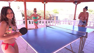Three best girlfriend are playing table tennis without bikini tops
