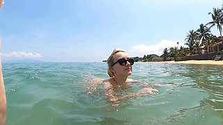 A sexy girl Lovita Fate playing on the beach in a bikini