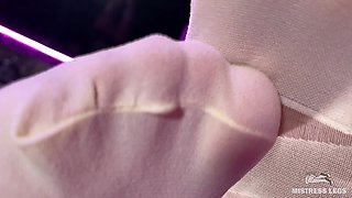 Under the Feet of the Mistress in White Pantyhose on the Bar Counter