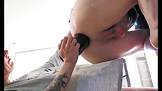 Fisting femdom with a huge dildo in her ass