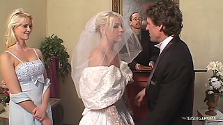 Blindfolded bride Missy Monroe receives a double surprise with two rock-hard cocks