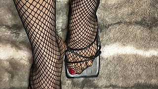 Fishnet in Open Toe Shoes with Red Nail Polish