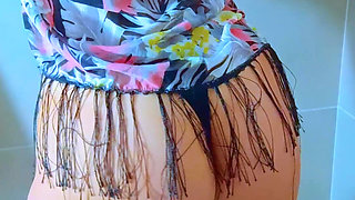 Watch This Stunning Brazilian Beauty Shower in a Black String Thong
