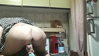 Housewife in the Kitchen with Brush in Pussy