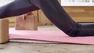 Petite yoga instructor. Bare feet, Nylon leggings
