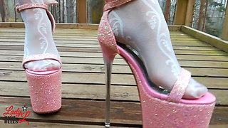 Lady L walking in towering pink extreme high heels.