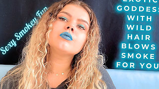 Exotic Goddess with Wild Hair Blows Smoke for You