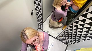 Gf gives a blowjob in the changing booth