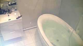 Young Brunette with Tattoos Masturbates with a Dildo in the Bathtub