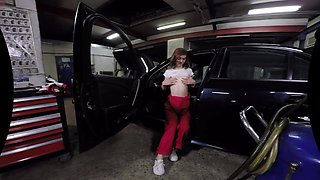Cute Female Mechanic Plays Solo in the Car Service