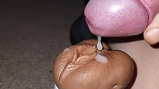 Slow motion cumshot into sex toy
